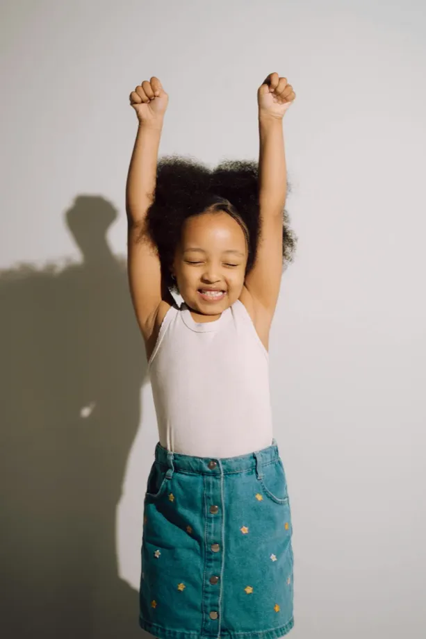 A proud child celebrating a win
